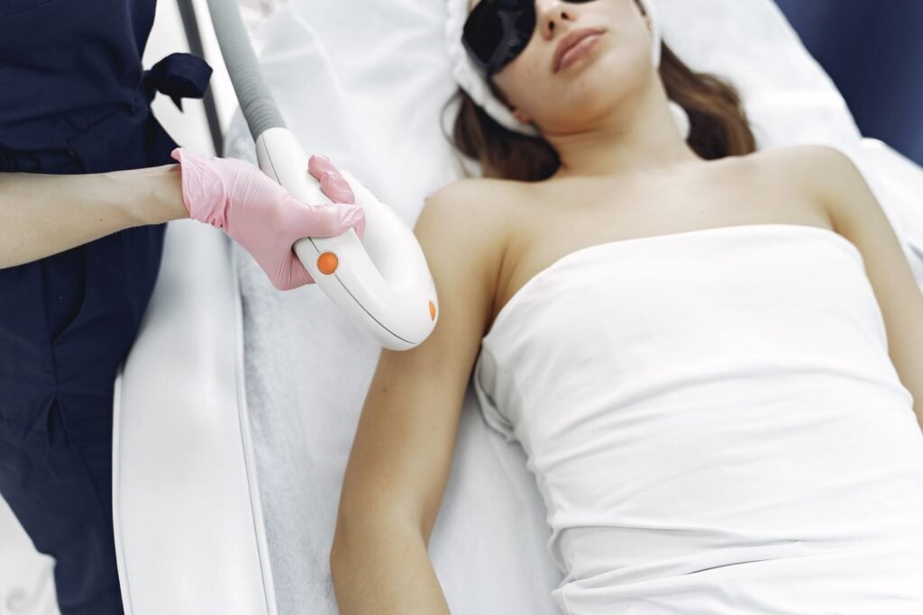 Laser hair removal treatment being performed in a clinic
